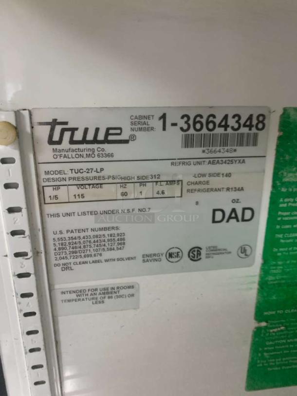 True TUC-27-LP undercounter refrigerator label, model and serial number visible, fully tested, prime condition.