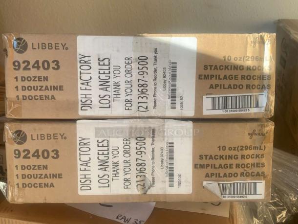 Brand new factory-sealed Libbey 92403 stacking rocks glasses, 10 oz, 1 dozen per box. Boxes with labels and barcodes visible.