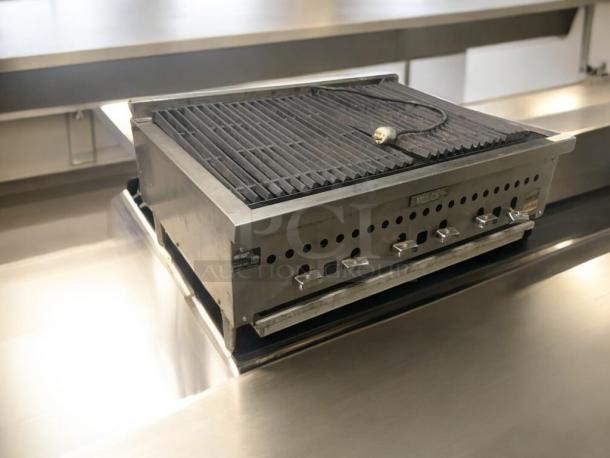 Commercial stainless steel countertop charbroiler, heavy-duty gas grill in superb condition, fully tested and working.