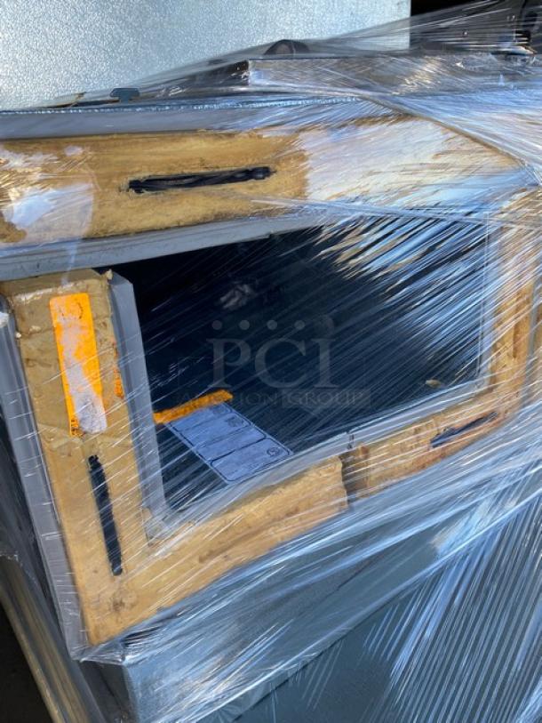 Norlake 6' x 6' walk-in cooler, model CPB075DC-A, wrapped for transport. Features self-contained compressor and condenser.