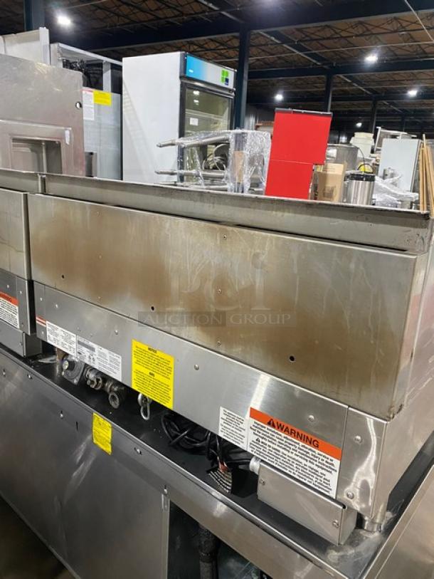 Woodstone 36" flat griddle, model WSGPL3636CT01NG, natural gas, stainless steel, with back and side splashes, on legs.