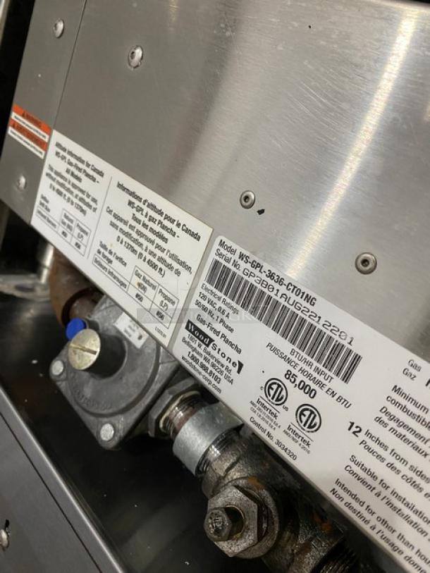 Woodstone WSGPL3636CT01NG 36" flat griddle, natural gas, stainless steel, model/serial labels visible, on legs.