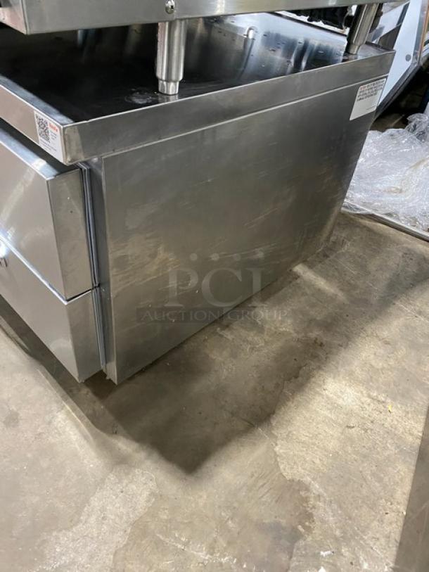 Woodstone stainless steel refrigerated work table, model WSGPL3636CT01NG, on commercial casters, with 4 drawers, serial 16249154.
