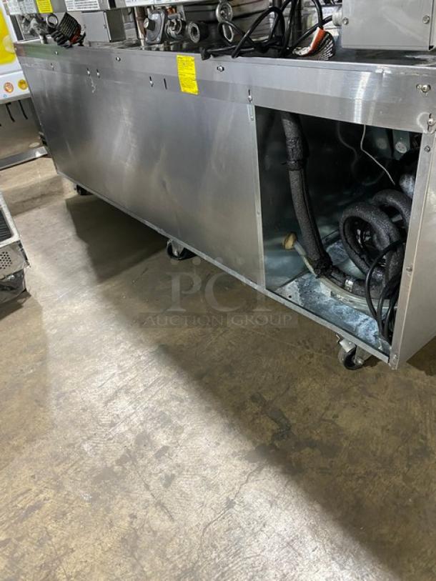 Stainless steel refrigerated work table by Woodstone, model WSGPL3636CT01NG, with 4 drawers. Includes serial 16249154, 115V, on casters.