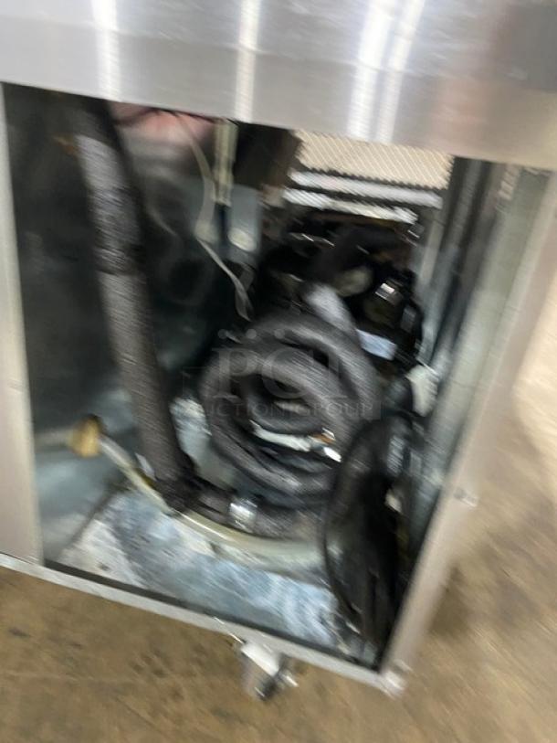 Stainless steel Continental refrigerated work table interior showing refrigeration coils and connections. Model WSGPL3636CT01NG.