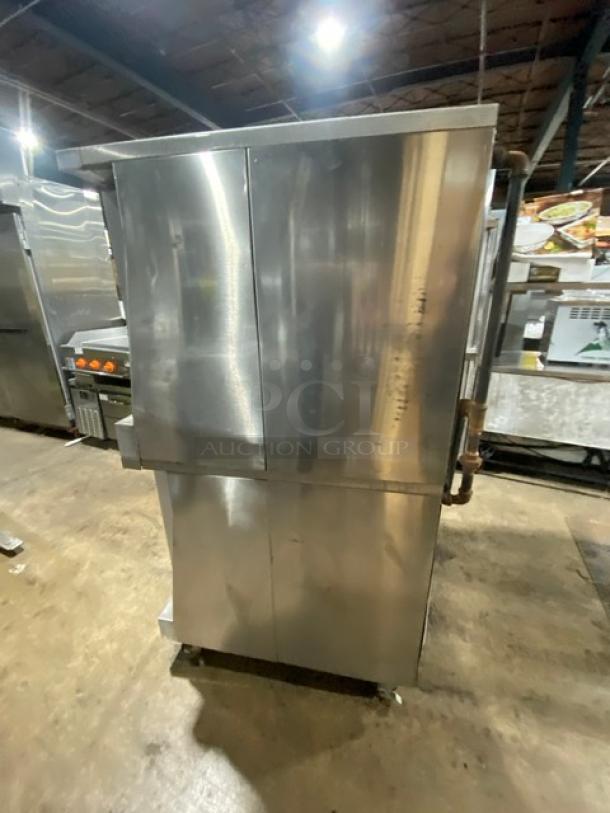 Garland Master 200 series double-stacked convection oven, stainless steel, natural gas, with view-through doors, on commercial casters.