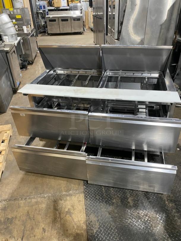 Welbilt/Delfield refrigerated prep table, model D4460NP-24M, stainless steel, 4 drawers, cutting board, commercial casters.