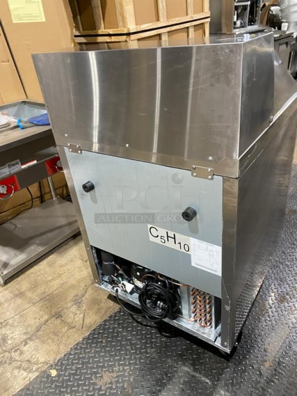 Atosa MSF8305GR commercial 27" refrigerated prep table, mega top, single door storage, on casters, model tag visible.