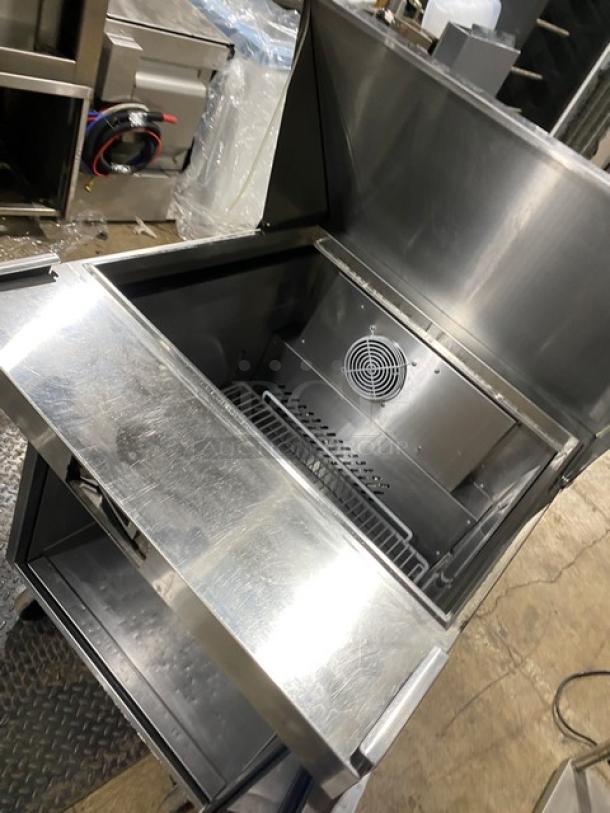 Atosa 27" refrigerated mega top prep table model MSF8305GR, open view, single door, stainless steel, on casters, excellent condition.