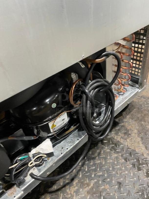 Atosa MSF8305GR refrigerated prep table, 27-inch, commercial, single door, storage, 115V, on casters, visible wiring.