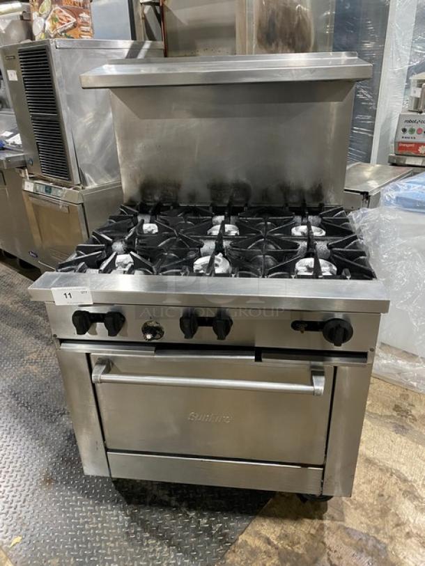 Sunfire X366R 6 burner stainless steel range/oven combo with raised backsplash and overhead salamander shelf on casters.