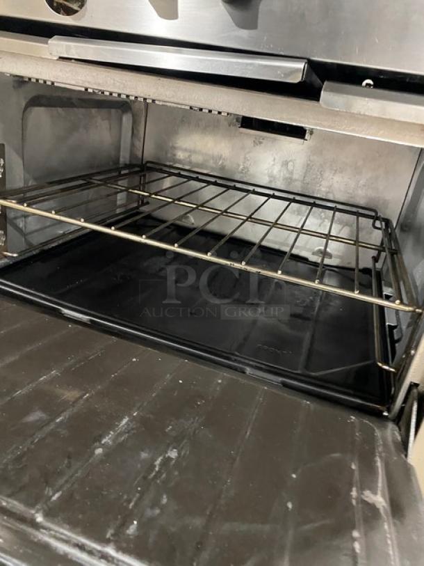 Sunfire Model X366R oven interior showing clean cooking rack and tray. Stainless steel finish, suitable for commercial use.