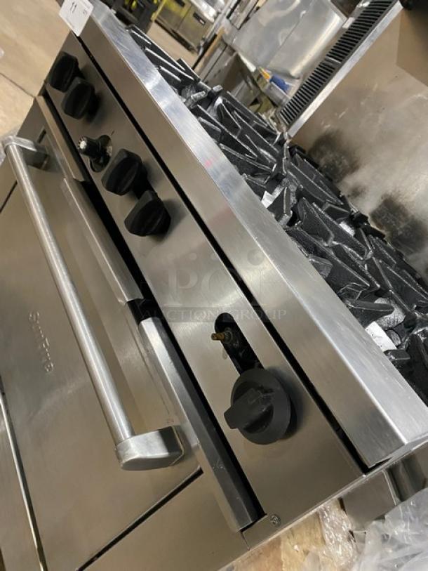 Sunfire X366R stainless steel 6-burner gas range/oven combo with raised backsplash and salamander shelf, on casters.