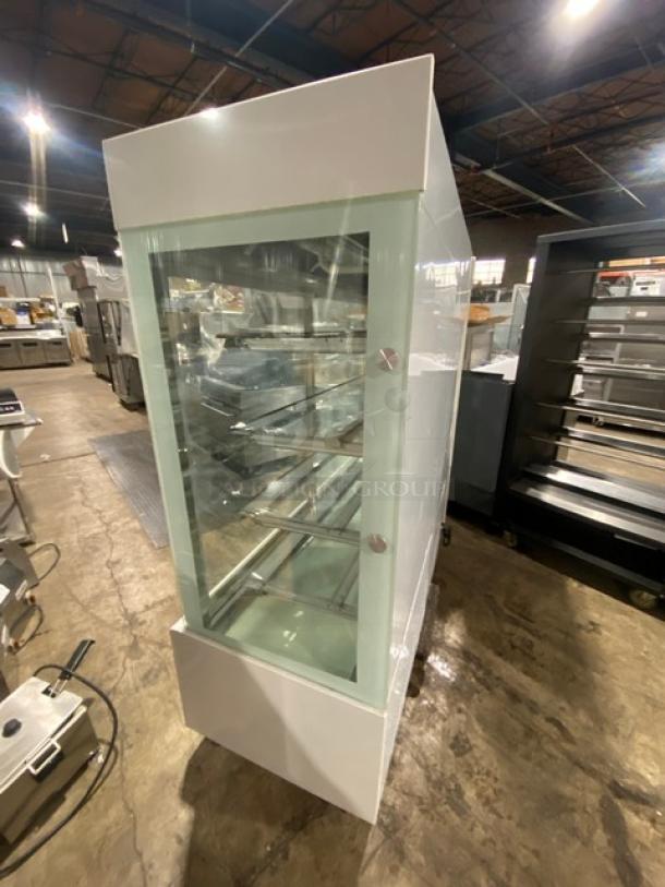 Commercial 5-tier refrigerated display case, model ZSGLLQ18, with sliding doors and glass showcase design. Condition appears gently used.