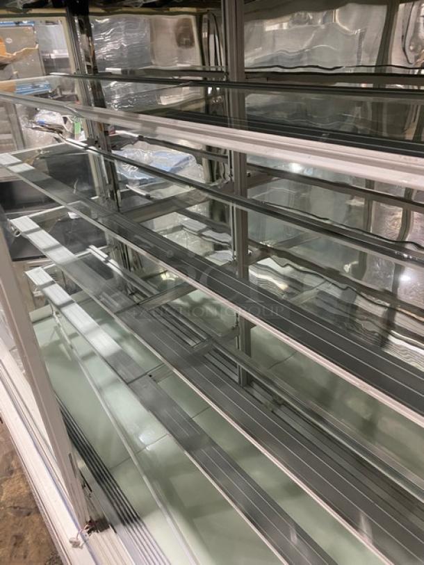 Commercial 5-tier glass display case, model ZSGLLQ18, with sliding doors, 220V, excellent condition.