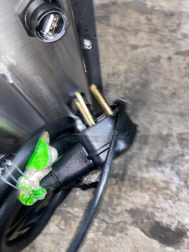 Close-up of MerryChef Eikon E2S oven power cord with plug. Features 208/240V connection. Shows wear and intact prongs.