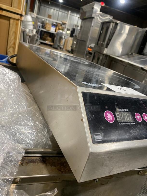 Vollrath Model 69507 Induction Range, dual burner, Intrigue Series. Stainless steel, electric, controls visible. Good condition.