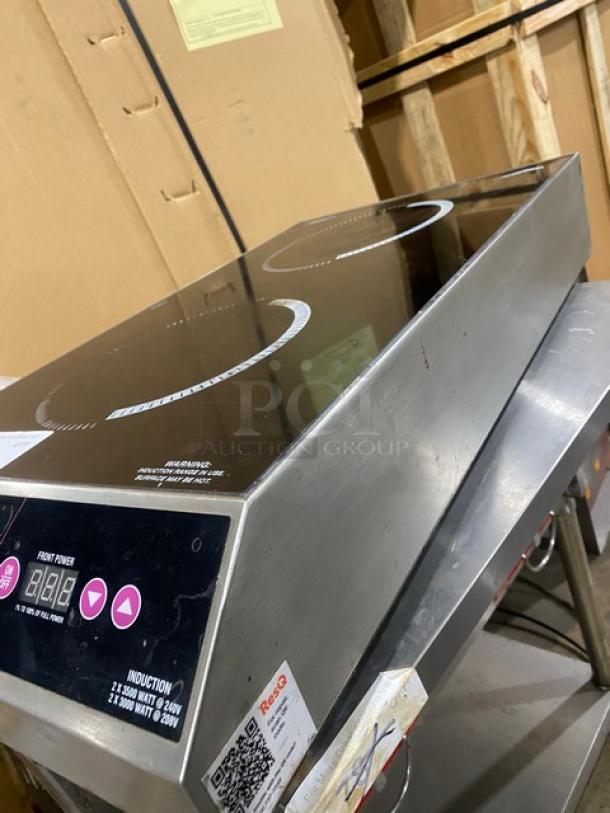Vollrath Model 69507 dual burner induction range, Intrigue Series. Stainless steel, electric, 208/240V, excellent condition.