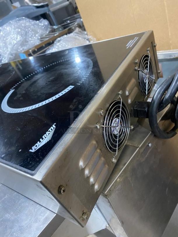 Vollrath Intrigue Series dual burner induction range, Model 69507, in used condition. Features controls and cooling vents.