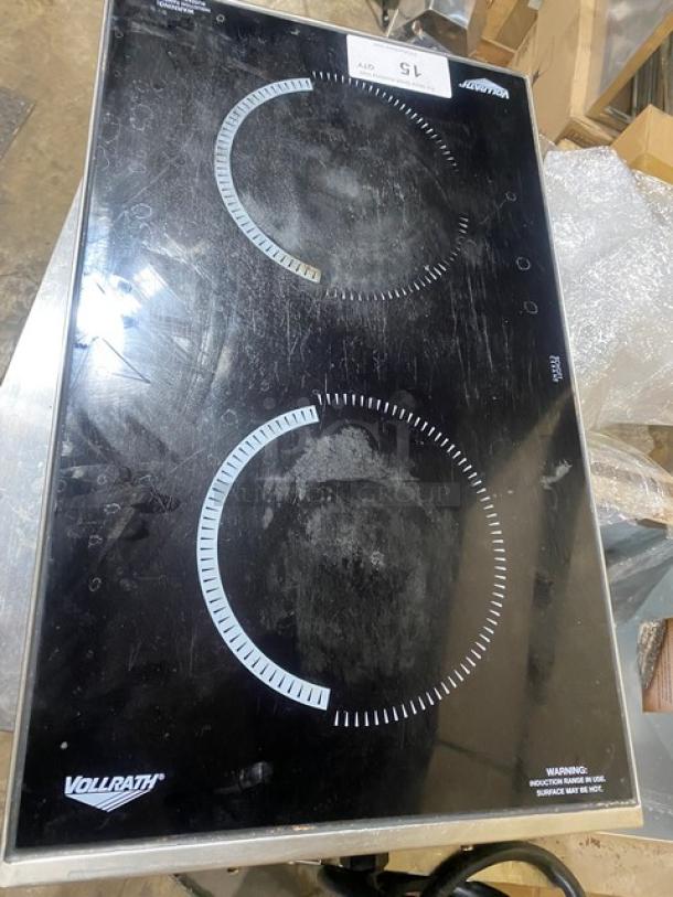 Vollrath dual burner induction range, Model 69507, Intrigue Series, black glass top, signs of use, 208/240V electric.
