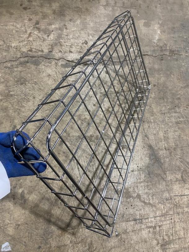 Metal bagel/bread display rack, chrome finish, wire construction, excellent condition, ideal for bakery or café use.