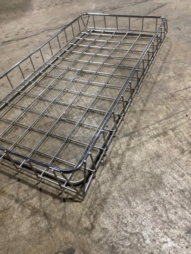 Metal bagel/bread display rack with grid design in good condition, ideal for bakery or retail use.