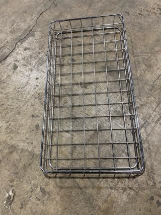 Metal bagel/bread display rack, rectangular, grid design, metal construction, used condition, suitable for bakery use.