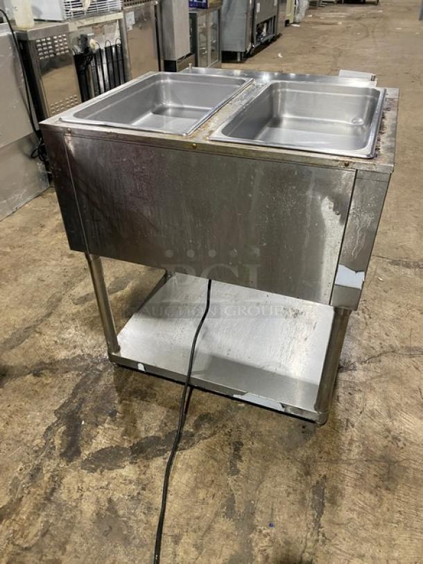 Omcan commercial 2-bay steam table, Model FZ06B1. Stainless steel with storage, electric-powered, used condition.