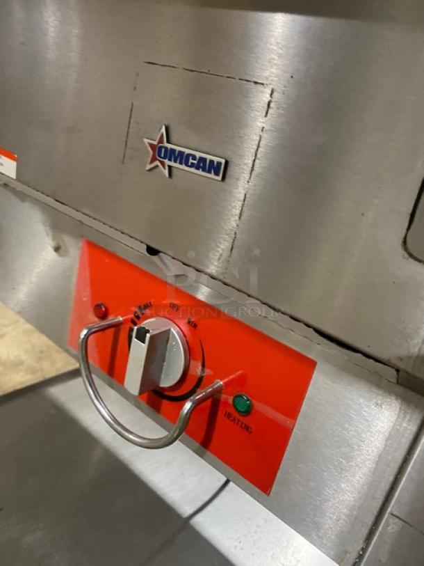 Omcan FZ06B1 stainless steel steam table, 2-bay, with underneath storage. Features heating controls, 120V, serial 690207445119.