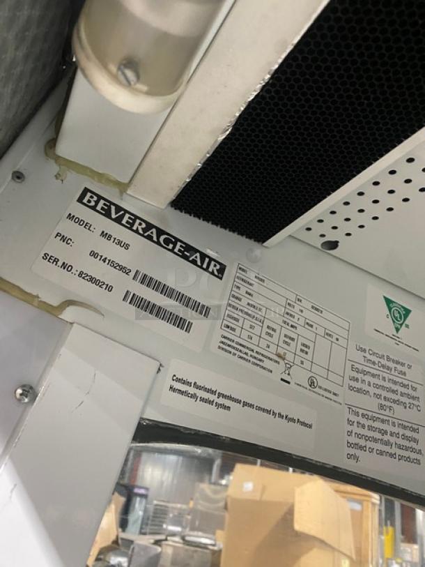Beverage Air Model MB13US commercial refrigerated display case label, showing model and serial number 82300210, 115V 1Phase.