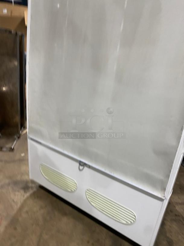 Beverage Air MB13US commercial refrigerated display case, 5 tiers, Model MB13US, Serial 82300210, 115V, 1 Phase, white exterior.