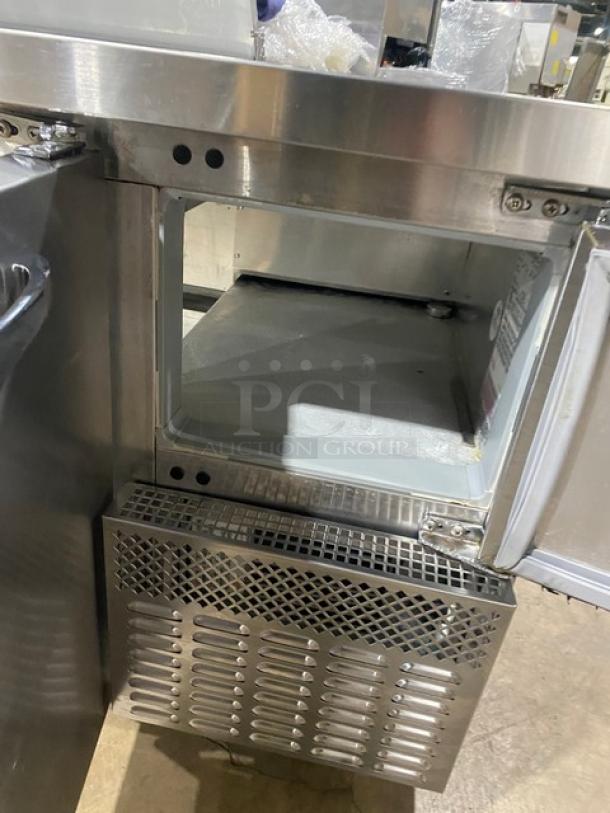 Continental RA68N8 stainless steel refrigerated sandwich prep table, 2.5-door storage, Model RA68N8, Serial 162B9697, 115V.