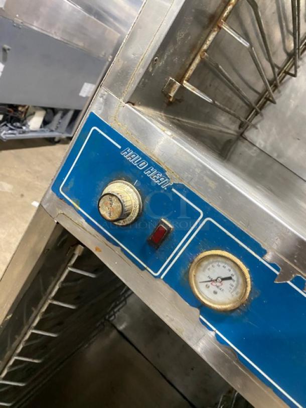 Alto Shaam Model 1000UP stainless steel heated food holding cabinet with dual Dutch doors. Features temperature gauge and controls.