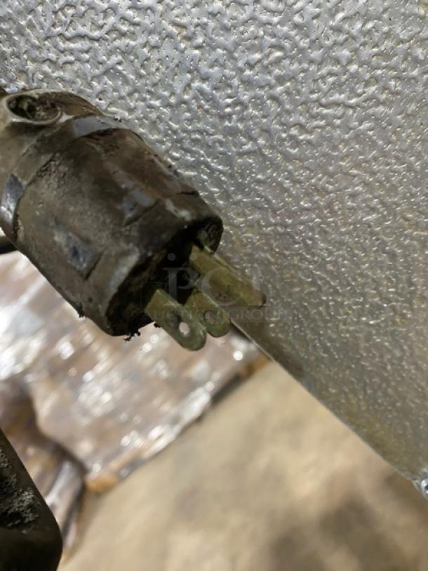 Alto Shaam 1000UP plug, showing wear. Commercial electric food holding cabinet, model details not visible.