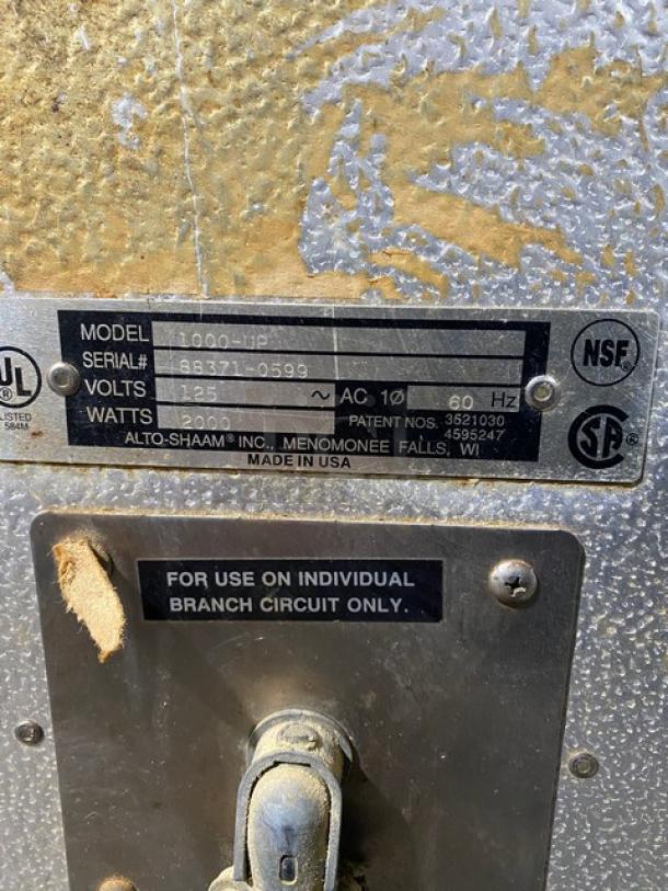 Alto Shaam commercial heated cabinet, model 1000UP, serial 883710599, 125V, stainless steel, dual Dutch doors, Halo Heat series.