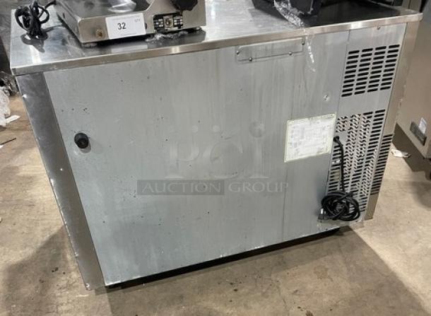 Everest ETR2 stainless steel lowboy/prep table with two-door storage, poly-coated racks, and casters, 115V, excellent condition.