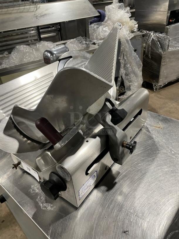 Heavy duty commercial countertop deli meat slicer, all stainless steel. Features adjustable blade, excellent condition.