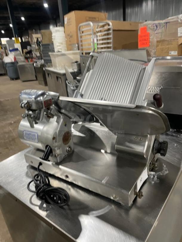 Heavy duty commercial countertop deli meat slicer, all stainless steel, featuring adjustable blade and sturdy build, excellent condition.