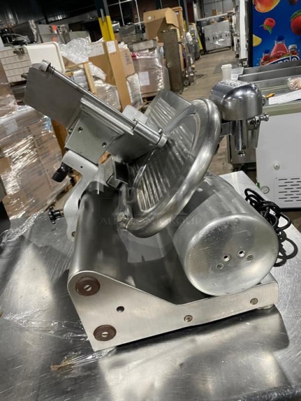 Heavy duty commercial countertop deli meat slicer, all stainless steel, excellent condition, visible power cord.