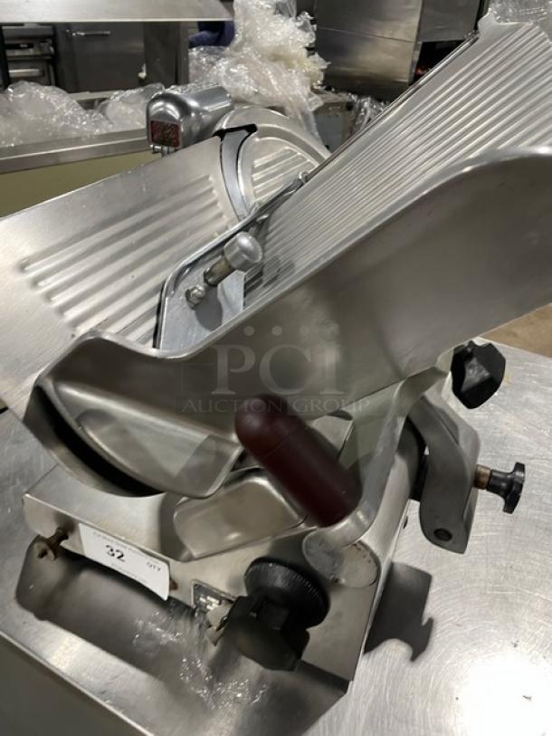 Heavy Duty Commercial Countertop Deli Meat Slicer, all stainless steel, used condition, with adjustment knobs and meat carriage.