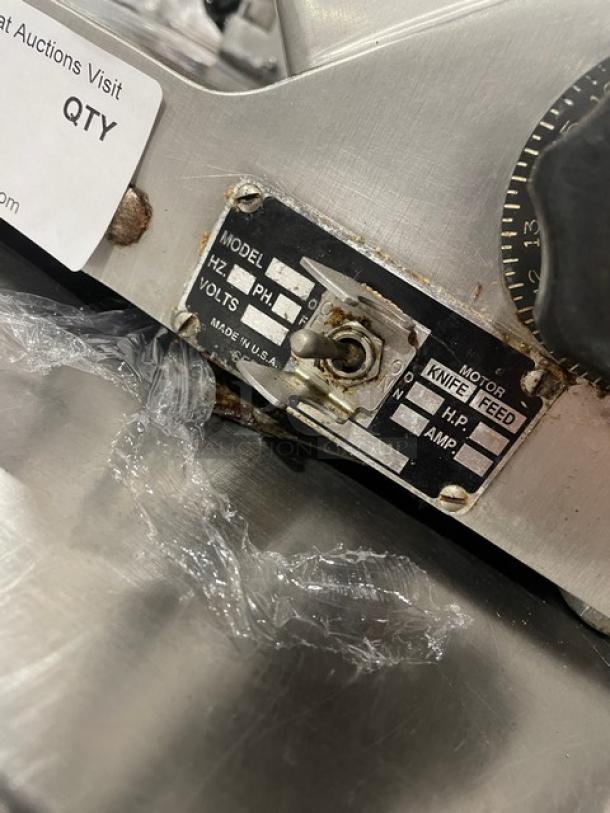 Heavy Duty Commercial Countertop Deli Meat Slicer, all stainless steel construction, visible model and voltage label, used condition.