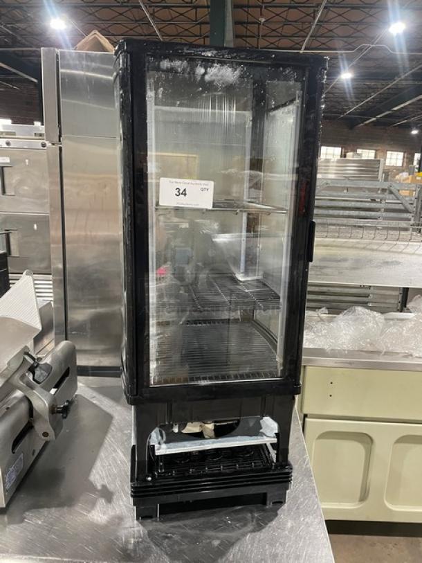 Winco CRD1K refrigerated display case, glass showcase style, model CRD1K, serial CRD1K070002270, 110/120V, used condition.
