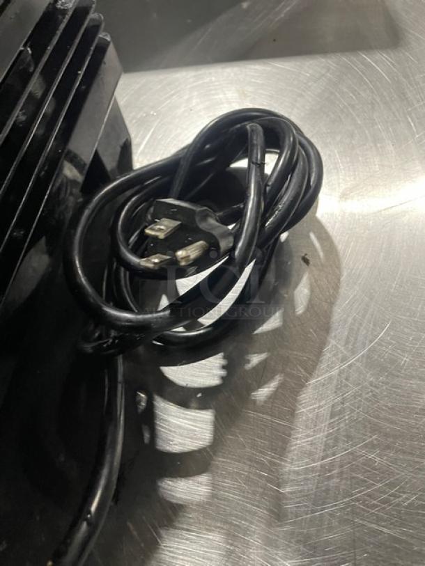 Winco Commercial Refrigerated Display Case Model CRD1K, glass showcase, 110/120V, with attached power cord.