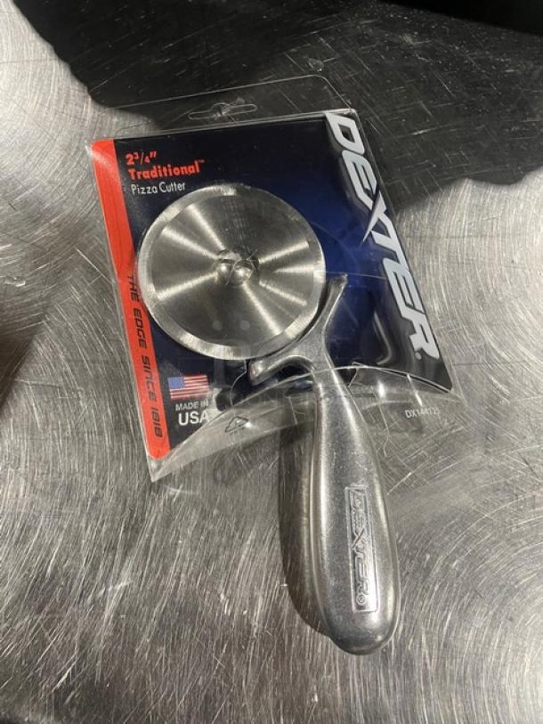 NEW Dexter 2 3/4" Traditional Pizza Cutter in packaging; stainless steel with ergonomic handle; made in USA.