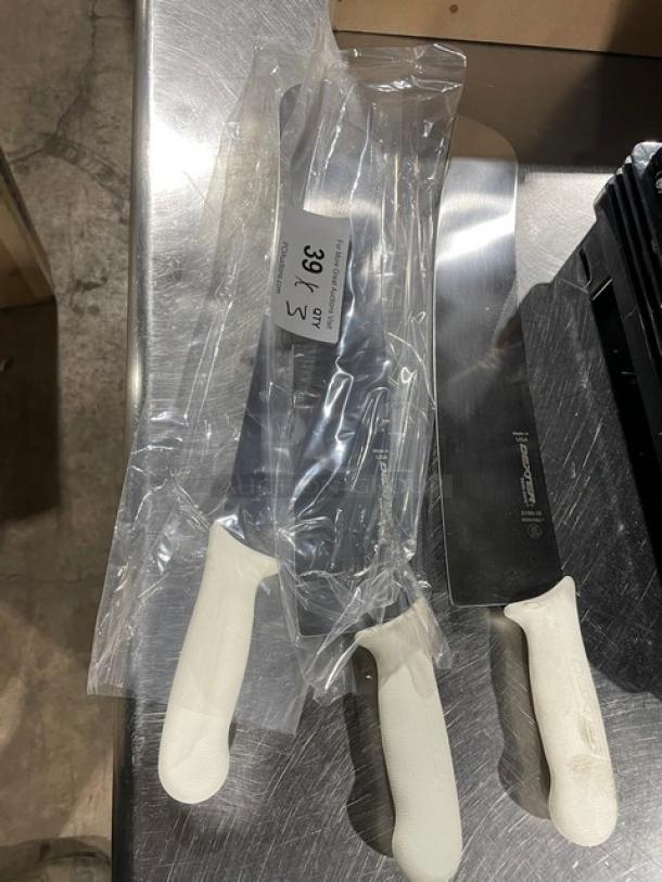 Dexter S16016 16" carbon steel pizza knife in new condition, white handle, labeled "39% Qty 3", in packaging.