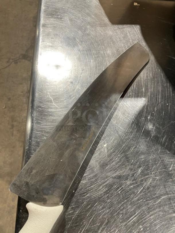 NEW 16" Dexter S16016 carbon steel pizza knife; commercial-grade, white handle, sleek design.