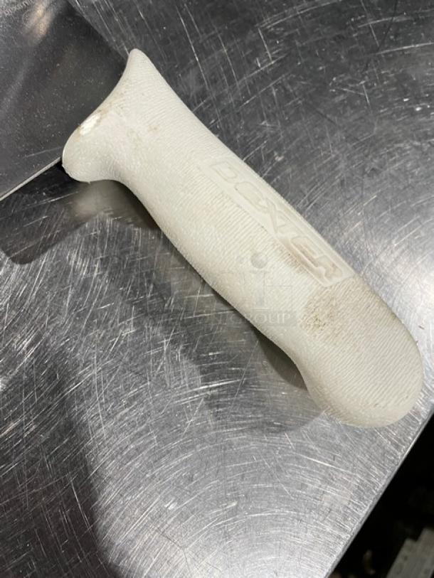 Dexter commercial 16" carbon steel pizza knife, model S16016, with a white ergonomic handle, new condition.