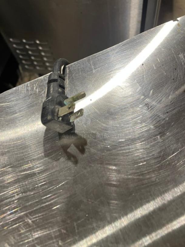 Continental UC48SS stainless steel cooler, model UC48SS, shows 2-door storage. Includes 115V plug. Serial: 15213433.