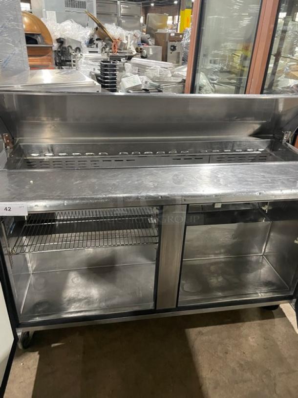 Turbo Air TST60SD refrigerated sandwich/salad prep table, stainless steel, 2-door storage, on casters, excellent condition.