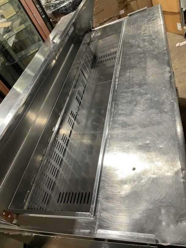 Turbo Air TST60SD refrigerated prep table with stainless steel build, 2-door storage, and casters; 115V, 1Phase.